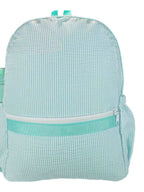 Light green textured backpack on a white background