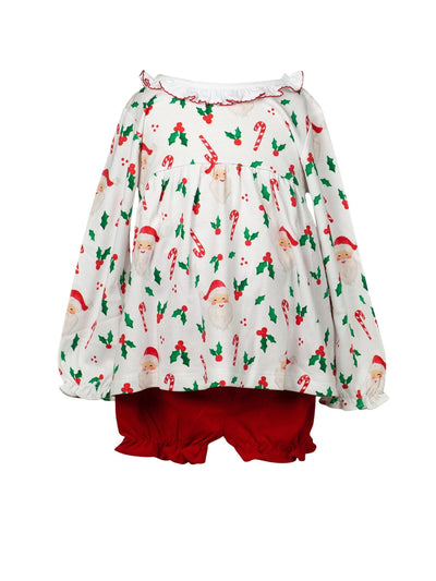 Children's outfit with a Christmas patterned top on a white background with red ruffle bloomers